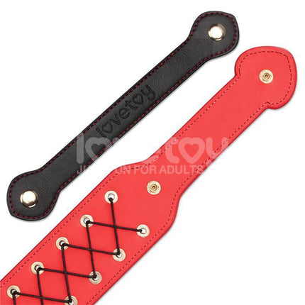 Rebellion Reign Rope Paddle 15 with crisscross woven textured surface in red and black, designed for bold sensations and style.