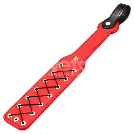 Rebellion Reign Rope Paddle 15 with black crisscross woven design on red paddle for bold sensations and unique style in adult play.