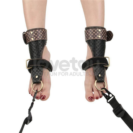 Rebellion Reign Under Mattress Restraint with PU cuffs and nylon straps for secure positioning in consensual adult play.