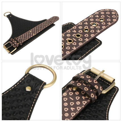 Rebellion Reign Under Mattress Restraint with PU cuffs and nylon straps for adult play, featuring a stylish design with heart patterns.