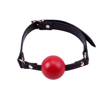 Red Ball Gag with a sturdy black strap, crafted from durable ABS plastic, featuring a smooth red finish for bold style and comfort.