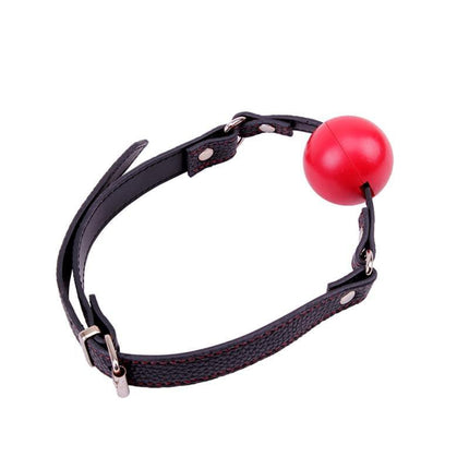 Red Ball Gag made from ABS plastic featuring a bright red ball and black strap for comfortable, stylish intimate play.