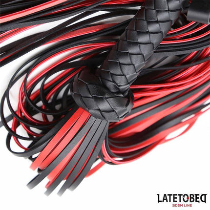 Close-up of Red Black Flogger 65 cm from LATETOBED with bold red and black design, featuring a braided handle and multiple tails.