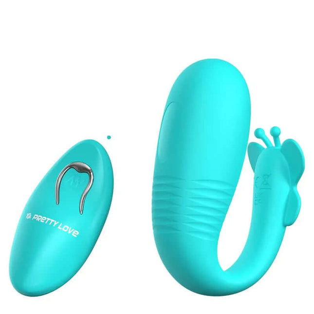 Remi Stimulator with Vibration and Thrusting in teal with a remote for intense, targeted pleasure. Ergonomic, velvety-smooth silicone.