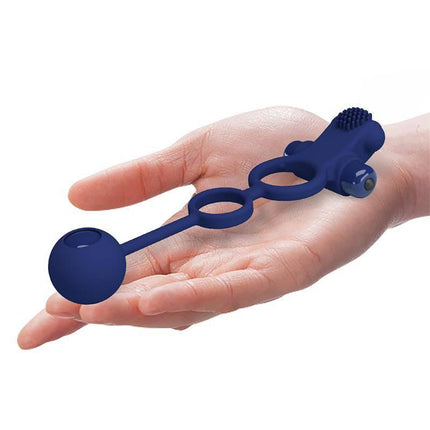 Hand holding Remington Double Vibrating Cock Ring, showcasing its dual-ring design and vibrating features for couples' multi-sensory stimulation.