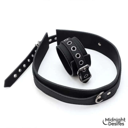 Restrain Set with Hand and Thigh Cuffs from Midnight Desires featuring adjustable black leather cuffs for stylish adult play.