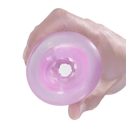 Reusable Male Masturbator in a hand showing its discreet and compact design