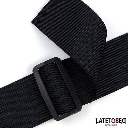 Close-up of black buckle from Ribbon Neck to Wrist Bondage by Latetobed BDSM Line, featuring adjustable strap for secure fit.