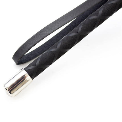 Close-up of Riding Crop 66 cm from the Latetobed BDSM Line featuring textured black material and silver handle for precision.