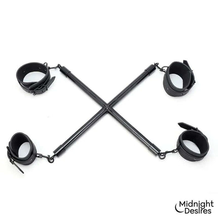 Rigid Crossed Bar with Cuffs featuring vegan leather cuffs for secure restraint, available from Midnight Desires.