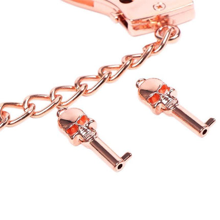 Close-up of Rose Gold Color Cuffs Skull Keys with intricate skull design and luxurious finish.