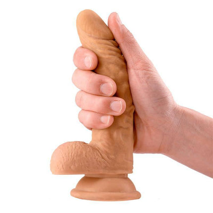 Hand holding Sam Realistic Dildo with Testicles 7.1 Flesh with suction base