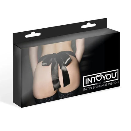 Packaging of Satin Bondage Satin Ribbon featuring luxurious black satin ribbon elegantly tied into a bow around a model's waist.