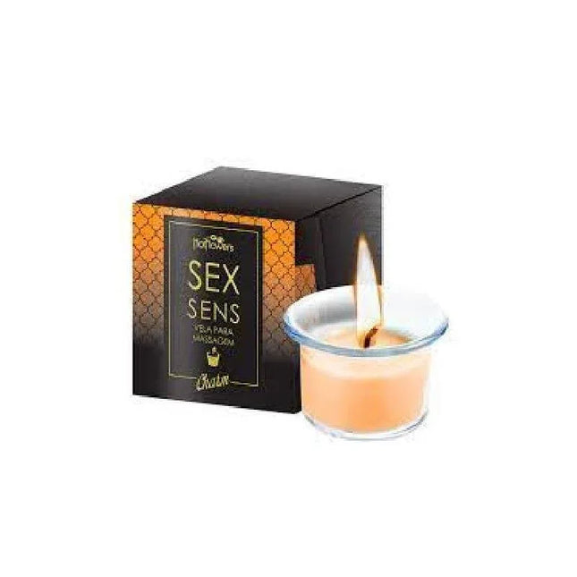 Scented massage candle Champagne with luxurious champagne aroma and massage-friendly wax in a glass container with packaging