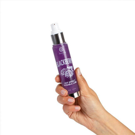 Hand holding Secret Play Hot Effect Blackberry Lubricant 50 ml bottle