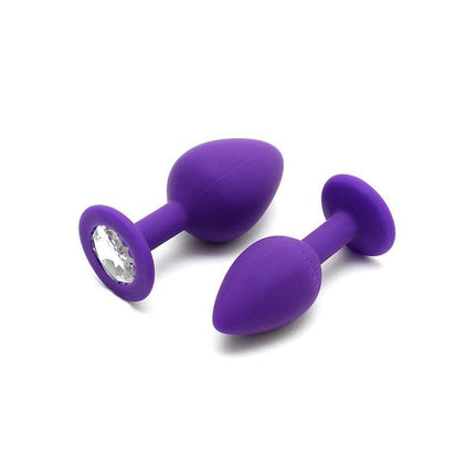 Set de Plugs Anales Berlin Purpura - two purple silicone anal plugs with jeweled base, designed for comfort and pleasure.