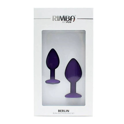 Set de Plugs Anales Berlin Purpura in packaging, featuring two purple silicone anal plugs with jeweled base for luxury and pleasure.