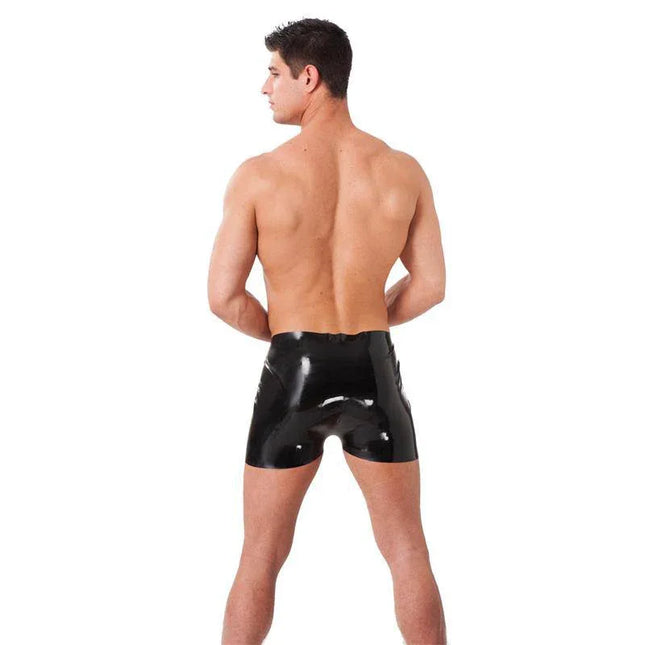 Back view of model wearing black Shorts Latex highlighting sleek, glossy finish and European design quality.