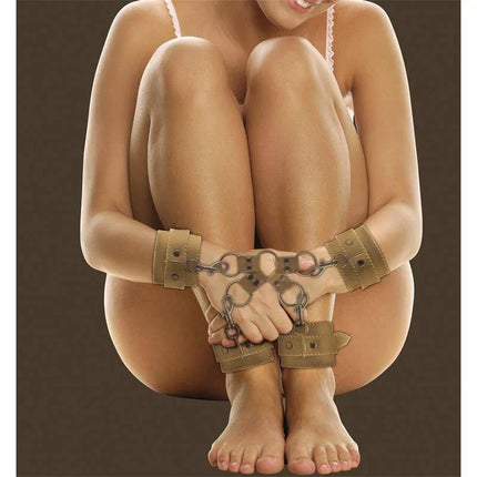 Person restrained in Shots Ouch! Brown Hogtie with premium leather and metal hardware, showcasing comfort and quality in bondage play.