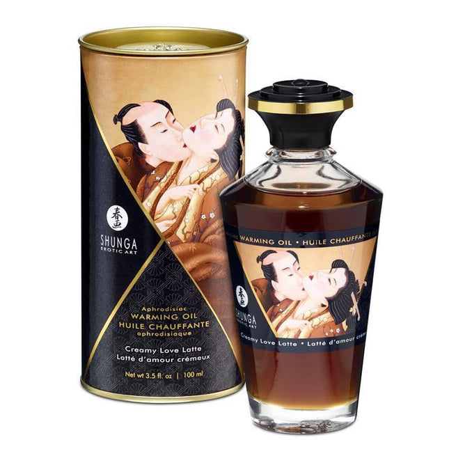 Shunga Warming Massage Oil Creamy Latte Aroma packaging and bottle, inspired by Japanese erotic art, offering a luxurious massage experience.