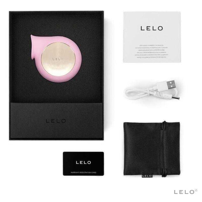 Sila Cruise Clitoris Sucker Pink with packaging, USB cable, and warranty card by LELO.