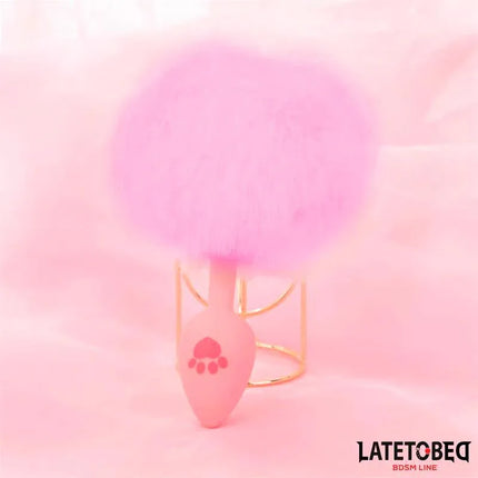 Silicone Anal Plug with Pompon Pink from Latetobed BDSM Line on display, featuring smooth silicone design and fluffy pompon accent.