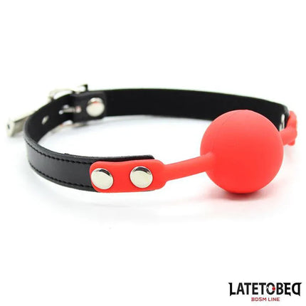 Silicone Ball Gag with Padlock Red featuring a bold red silicone gag with black strap, secured by a silver padlock for adventurous play.