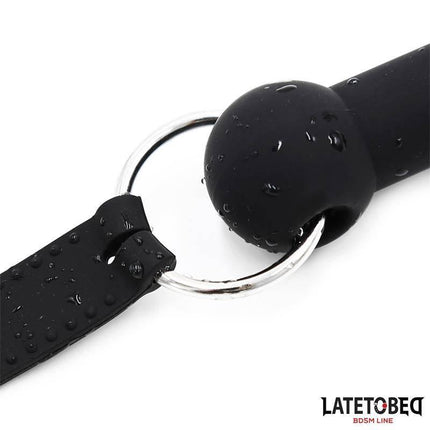 Close-up of the Silicone Bone Gag Adjustable, showing its black premium silicone material and metal ring detailing for secure fit.
