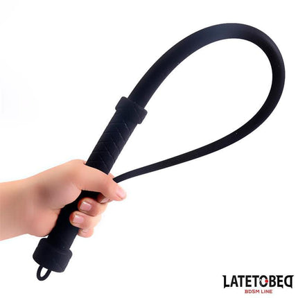 Silicone Whip 61 cm from Latetobed BDSM Line with flexible silicone design held in hand for sensory play.