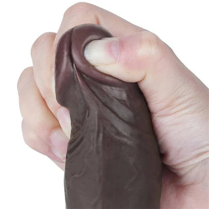 Hand squeezing Sliding Skin Dual Layer Dildo 8, showcasing its realistic dual-density texture and lifelike sensation.