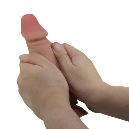 Hands holding Sliding Skin Realistic Dildo 19.4 cm with lifelike texture and skin-tone appearance.