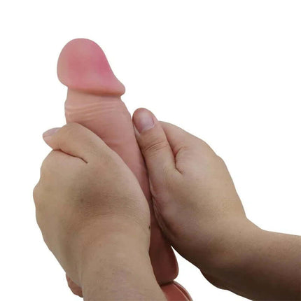 Hands holding Sliding Skin Realistic Dildo 20.6 cm for enhanced lifelike pleasure