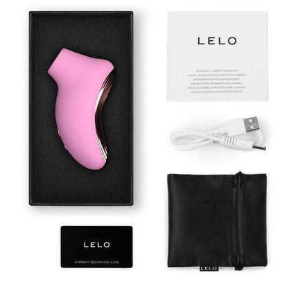 Sona 2 Travel Clitoris Sucker Pink in box with accessories, featuring compact, discreet design for sonic clitoral pleasure.