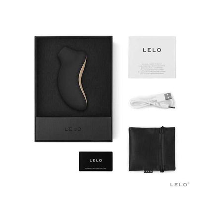 Sona Clitoris Sucker Black with accessories shown in packaging, including USB charger, bag, and instructions.