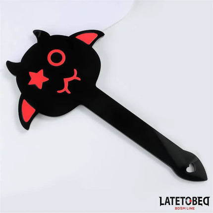 Spanking Paddle 25.2 cm from Latetobed BDSM Line with playful devil design and heart-shaped handle, ideal for intimate experiences.
