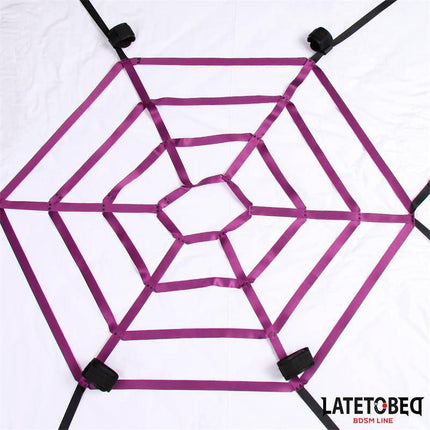 Spider Web Bed Bondage from Latetobed BDSM Line featuring a purple spiderweb design for secure and immersive play.