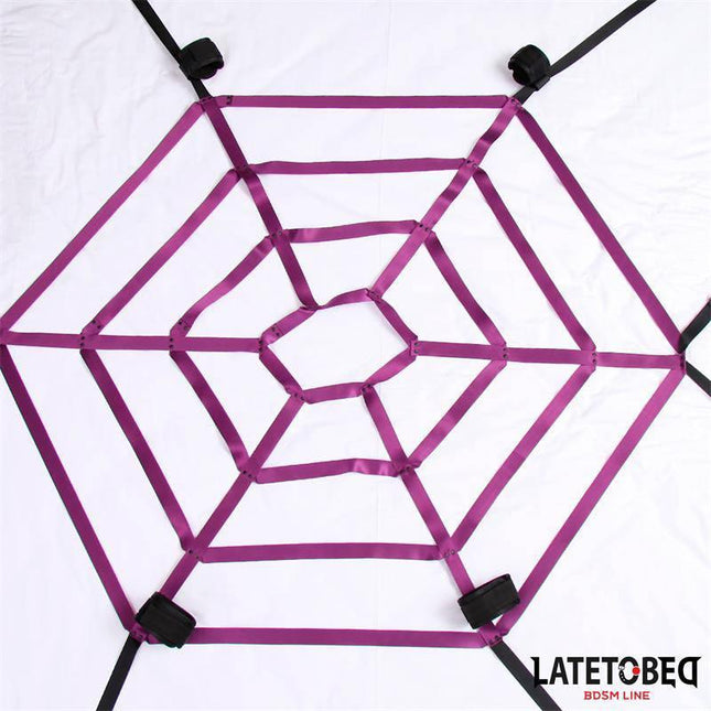 Spider Web Bed Bondage from Latetobed BDSM Line featuring a purple spiderweb design for secure and immersive play.