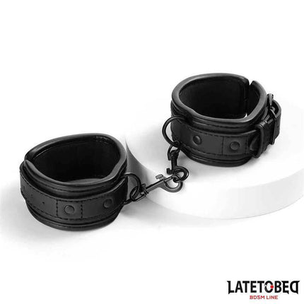 Sponge Lined Handcuffs from Latetobed BDSM Line, featuring black padded restraints on a white background.