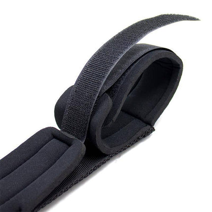 Black soft cuff detail from Spreader Bar with Rigid Bar and Soft Cuffs, featuring a smooth surface for comfortable restraint during play.