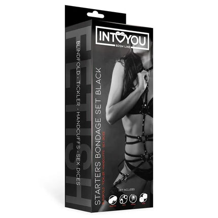 Box packaging of Starters Bondage Set 4 Pieces Black from Intoyou featuring a model wearing BDSM accessories.