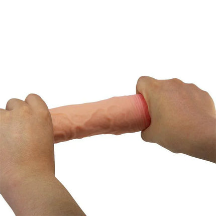 Hands holding Stevenson Penis Extended sleeve with lifelike texture.