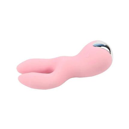 Stimulator Dreamlike Rabbit, a pink compact vibrator with ergonomic handle and rabbit ears for precise stimulation.