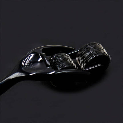 Stimulator Wheel Prick Spike with ergonomic handle and dual-row pinwheel for precision in BDSM play on dark background