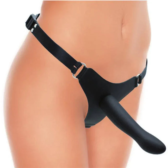 Strap-on with Dildo Silicone 16cm attached to a harness worn by a person, showcasing black 100% silicone design, smooth and body-safe.