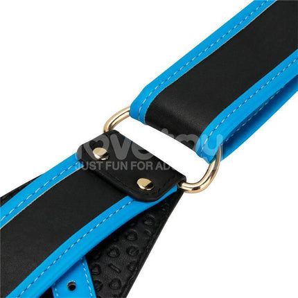 Close-up of adjustable strap for Strap On with Vibrating Dildo 8.5, featuring blue and black design with metal rings for secure fit.