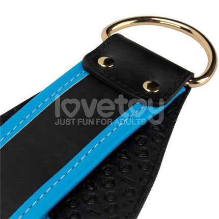 Close-up of black and blue strap detail on Strap On with Vibrating Dildo 8.5, highlighting secure construction and quality material.