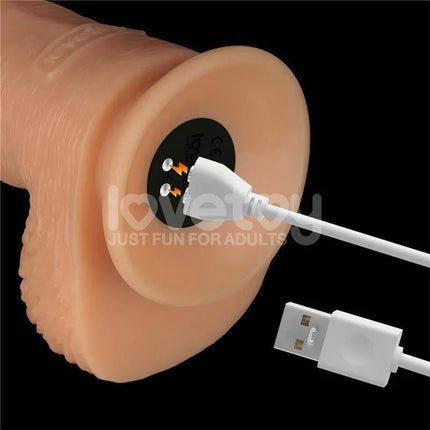 Close-up of the Strap On with Vibrating Dildo 9.5 charging port and USB cable.