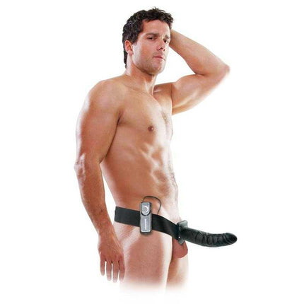 Man wearing Strap-On with Vibrating Hollow Dildo 8 Black, featuring comfortable harness and remote control for adjustable vibrations.