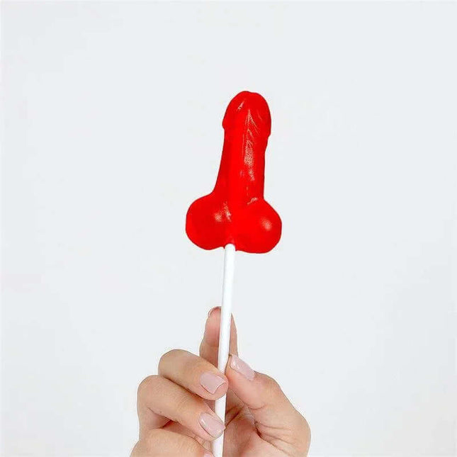 Strawberry Penis-Shaped Lollipop held up, highlighting its playful and humorous design.