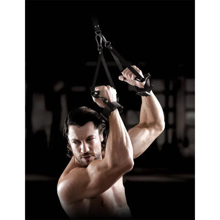 Man using Suspension Cuff Set with industrial-strength nylon straps in a gym setting